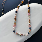 Hand-knotted multi bead necklace with teardrop charm